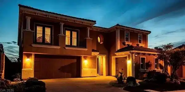 Image 4: Illuminated exterior showcasing a stylish garage,