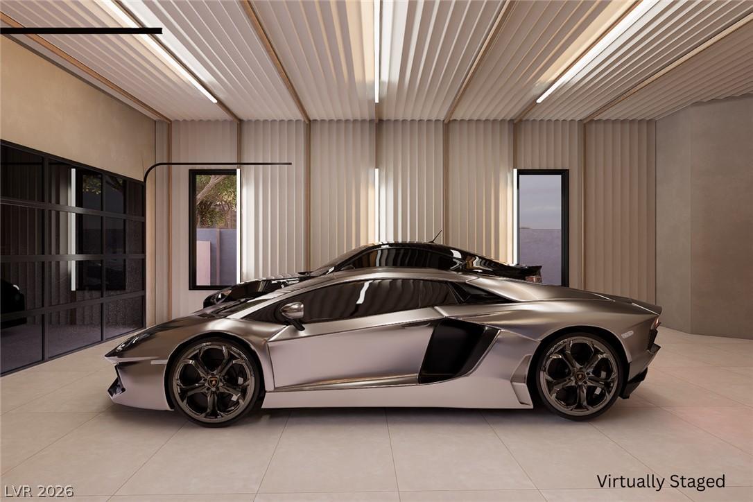 Image 4: A luxury garage showcases sleek vehicles and moder