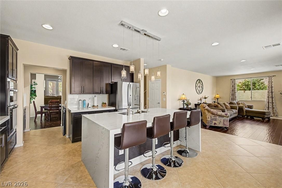 Image 3: This open-concept kitchen seamlessly connects to t