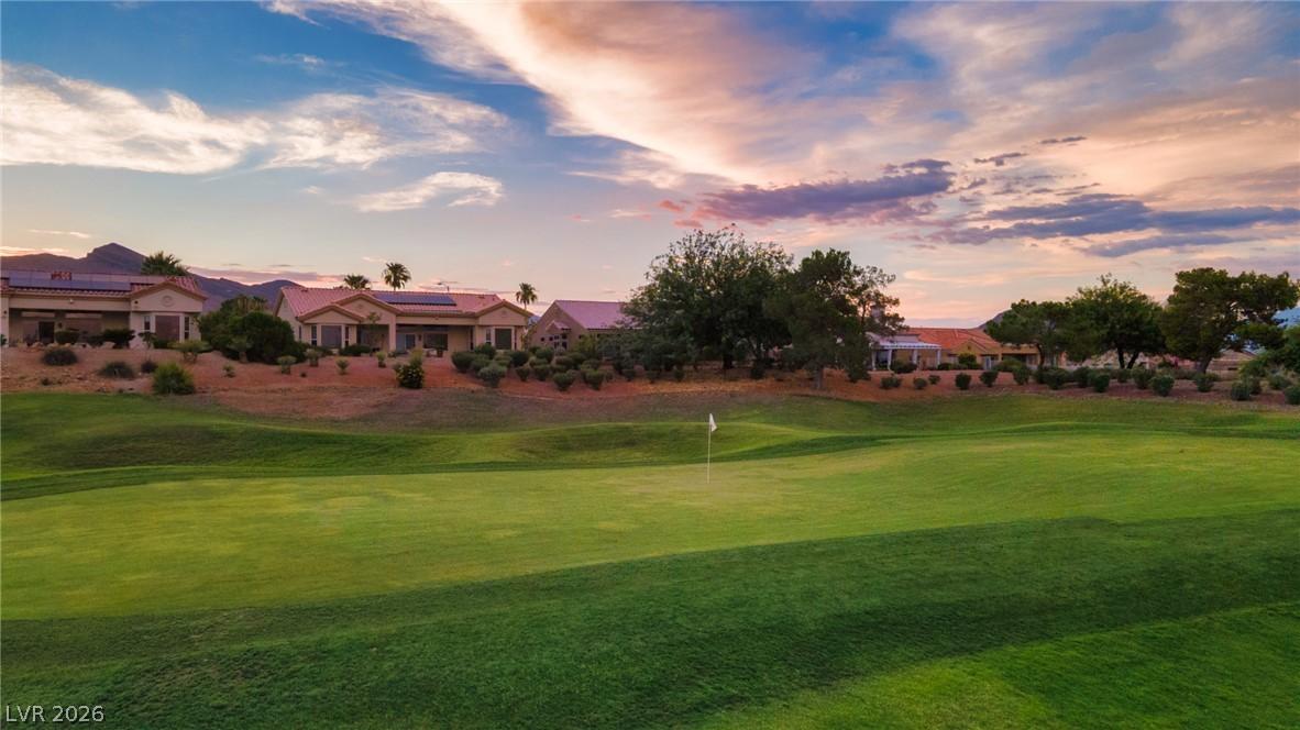 Image 1: A peaceful golf course setting frames desert homes