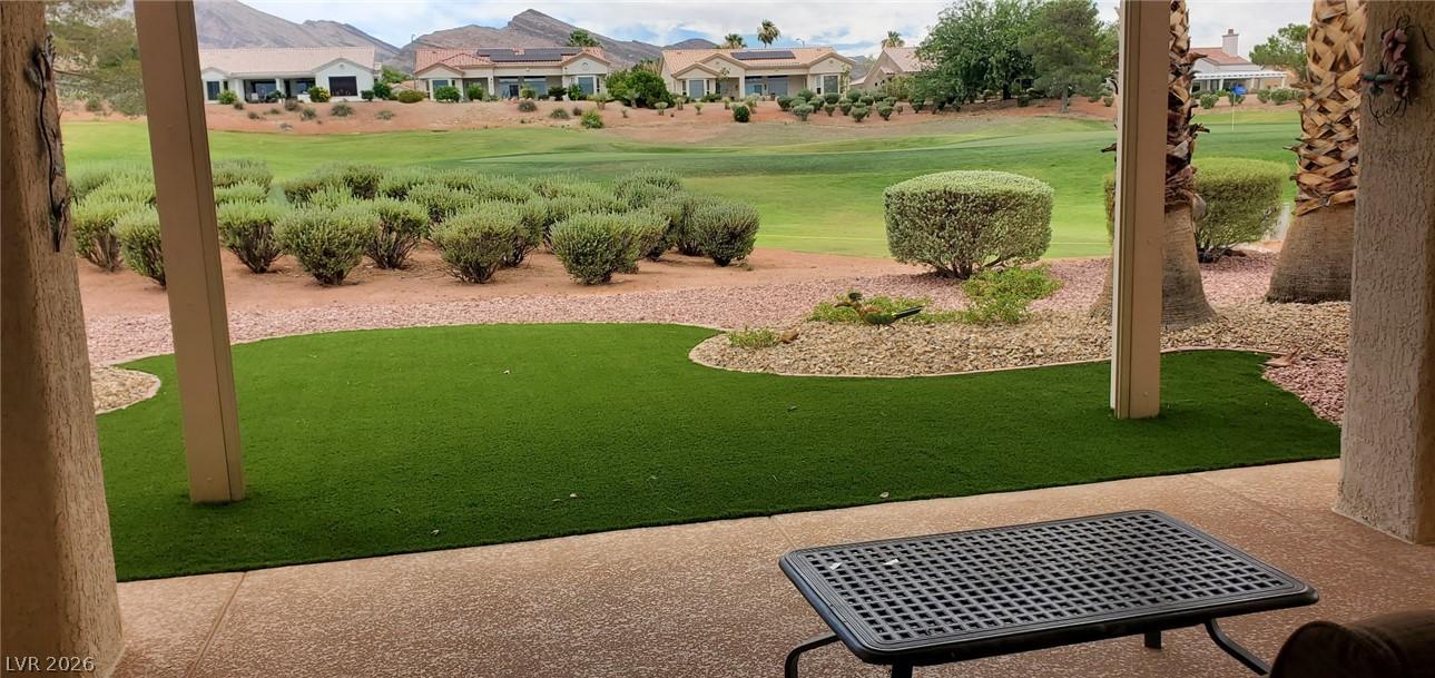 Image 2: Enjoy golf course views from this inviting patio w