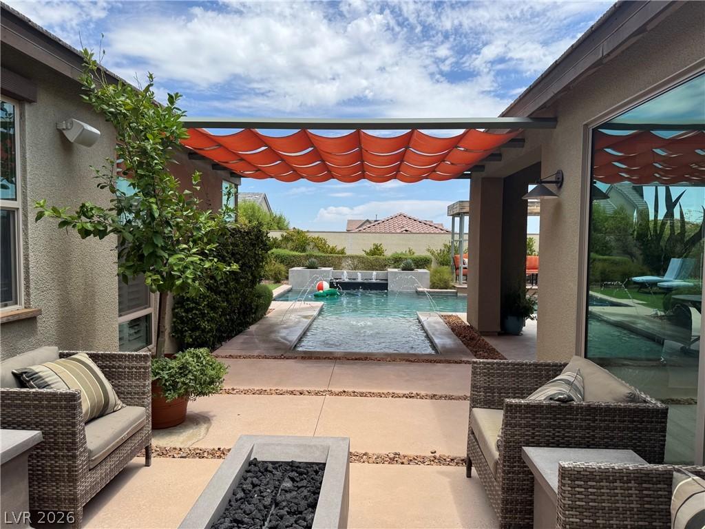 Image 2: An inviting outdoor oasis features a private pool