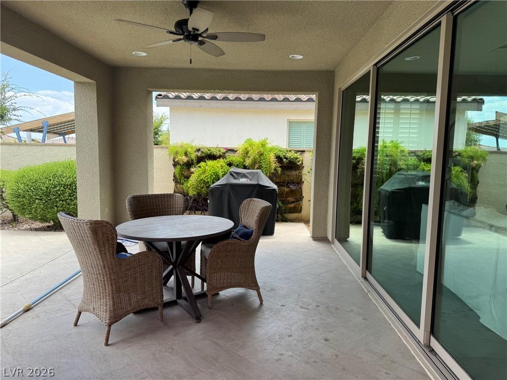 Image 3: An inviting covered patio area offers a perfect sp