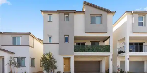 Image 4: View of front of house featuring stucco siding, a