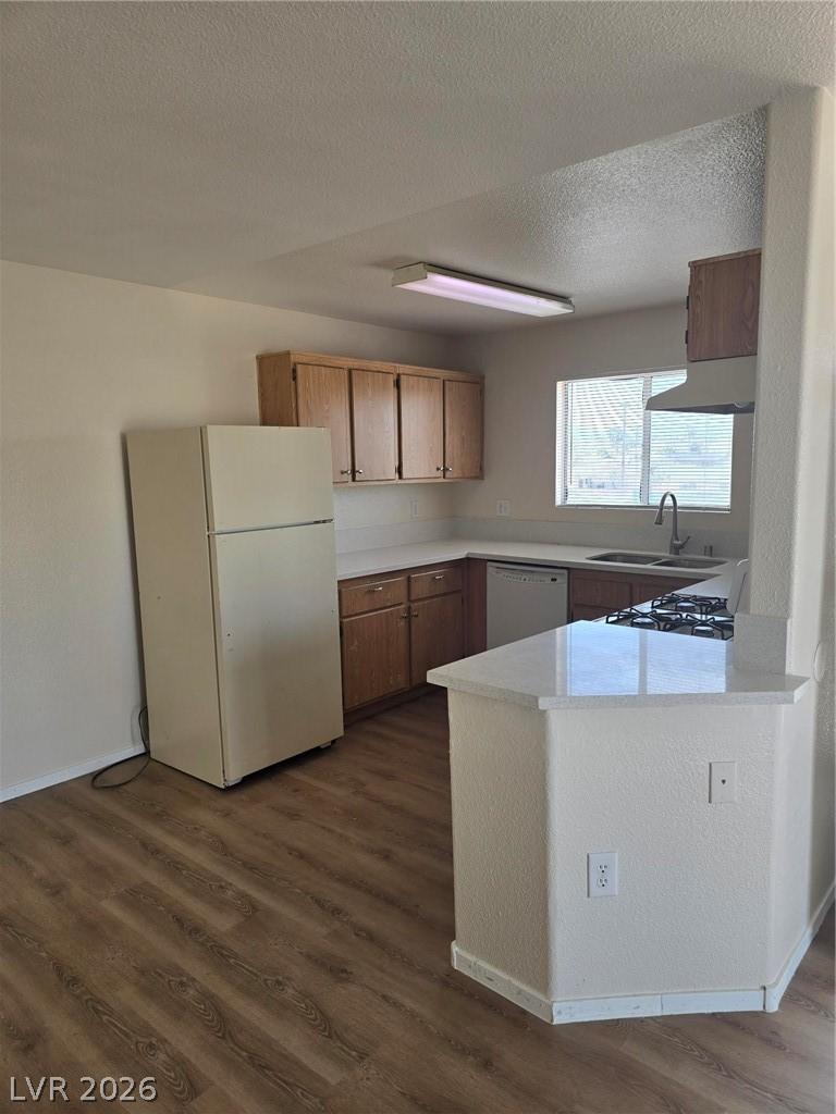 Image 3: Kitchen featuring refrigerator, wood finish cabine