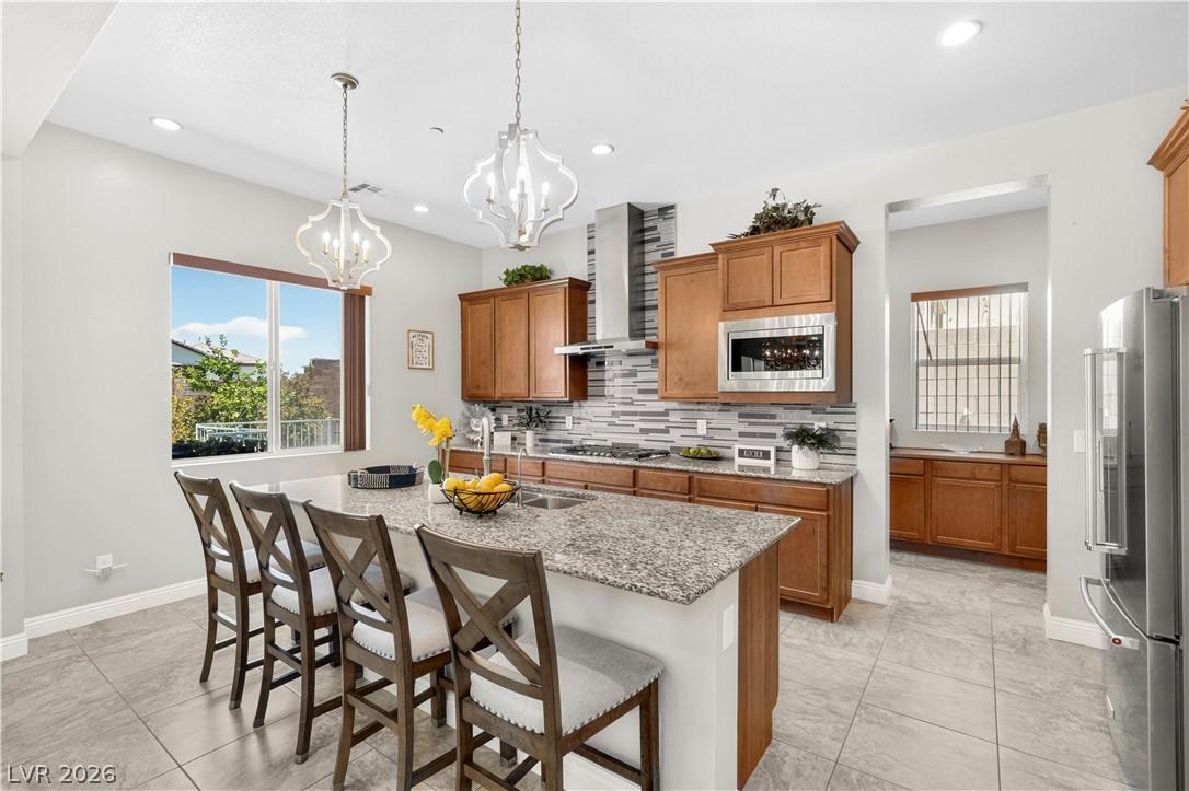 Image 4: An inviting kitchen with a granite island and slee