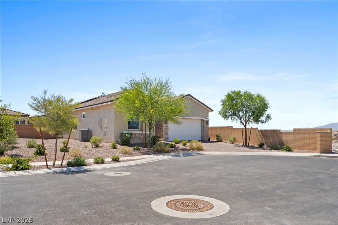 Image 4: A well-maintained facade with a private driveway,