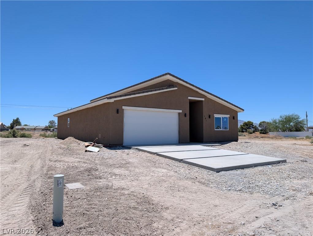 Image 2: A newly constructed residence features a modern ex