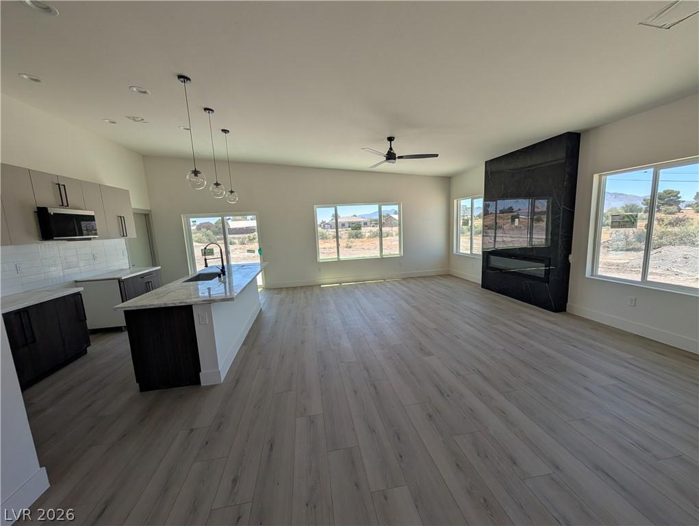 Image 4: An open-concept living space with a contemporary f