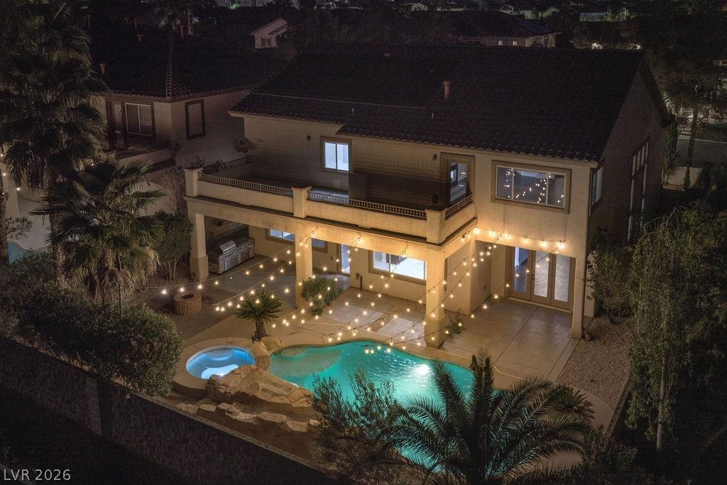 Image 2: Resort-style backyard &mdash; heated pool, spa, water sl