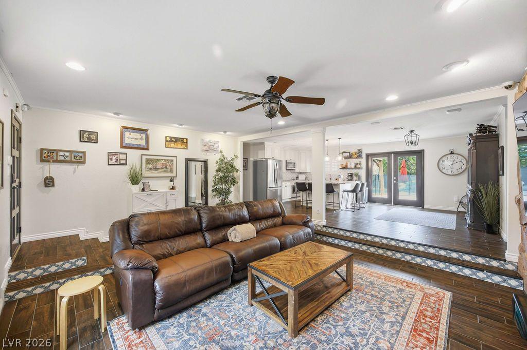 Image 4: An inviting, split-level living area seamlessly co