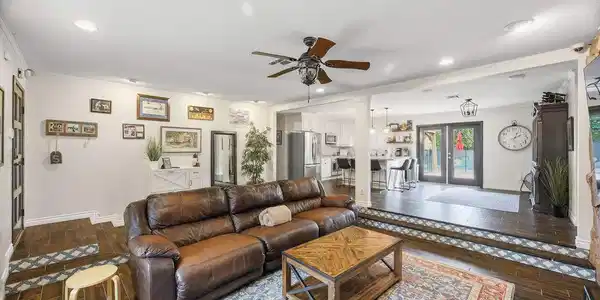 Image 4: An inviting, split-level living area seamlessly co