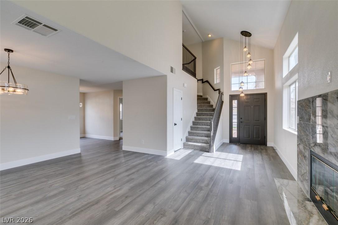 Image 2: A striking two-story foyer welcomes guests, boasti