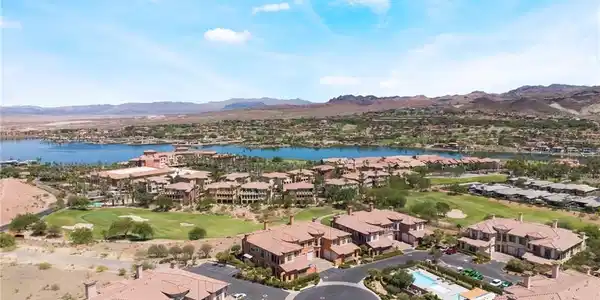 Image 3: An aerial perspective reveals a vibrant lakeside c