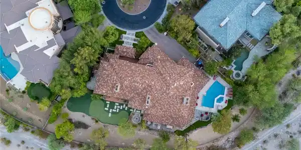 Image 3: An aerial perspective showcases the property nestl