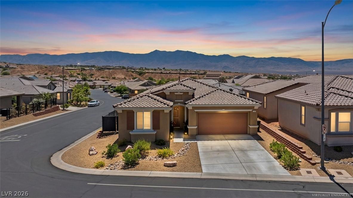 Image 1: A terracotta-tiled roof crowns this desert home, f