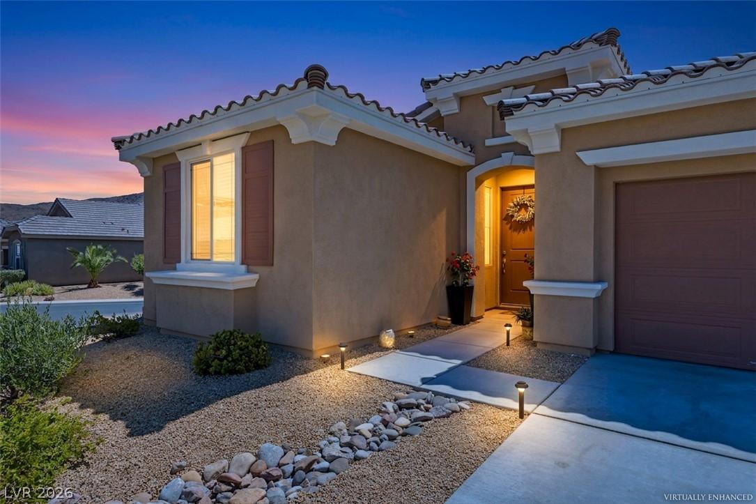 Image 3: A welcoming entry, with a subtle glow, illuminates