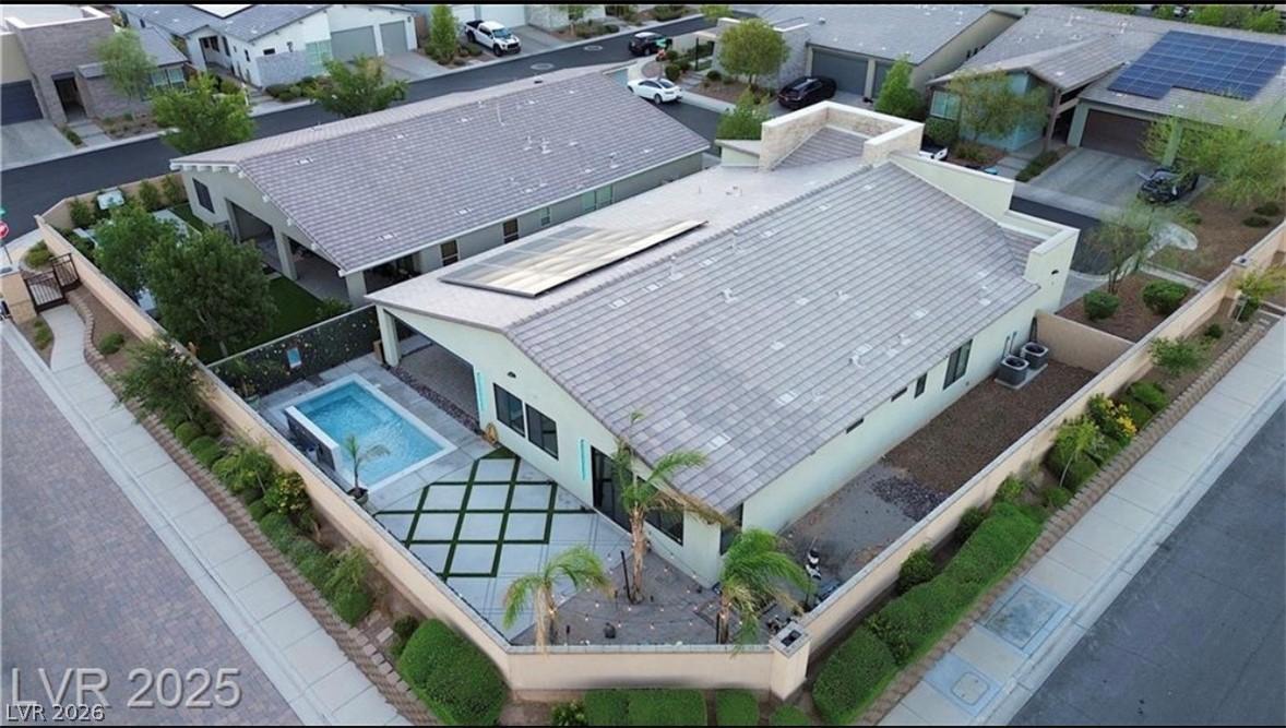 Image 2: An aerial perspective reveals a modern home with a