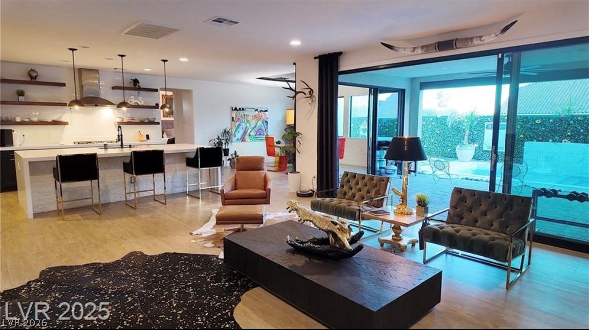 Image 4: An open-concept living space integrates a stylish