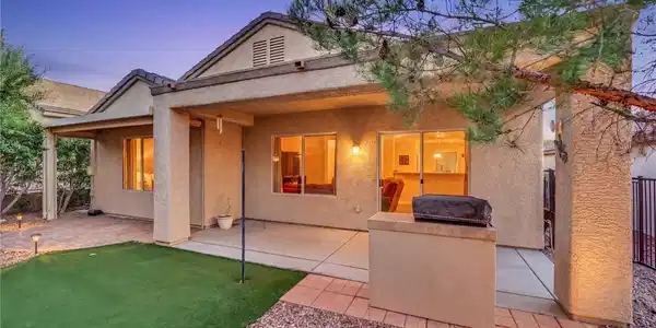 Image 2: A spacious backyard patio, perfect for evening gat