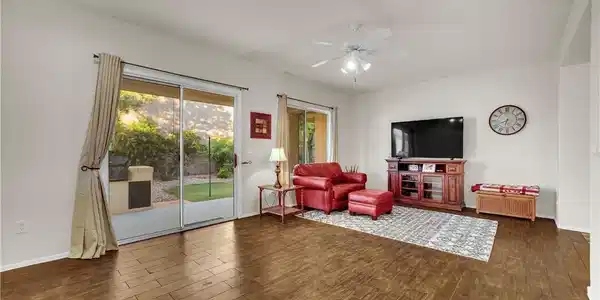 Image 3: Hardwood-style flooring and sliding glass doors cr