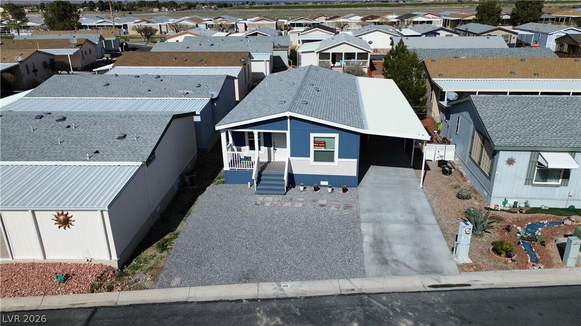 Image 2: A welcoming front facade with a covered carport of