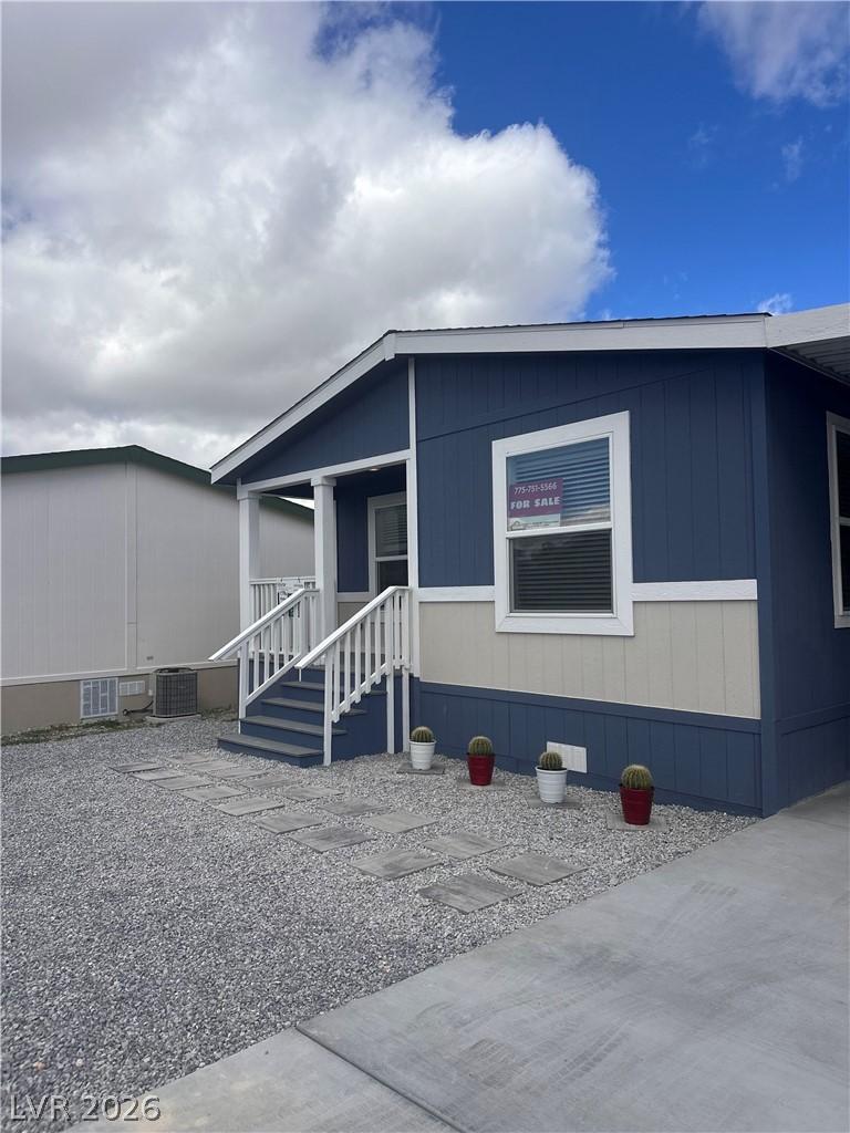Image 3: A neatly maintained exterior with a welcoming porc
