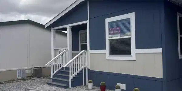 Image 3: A neatly maintained exterior with a welcoming porc