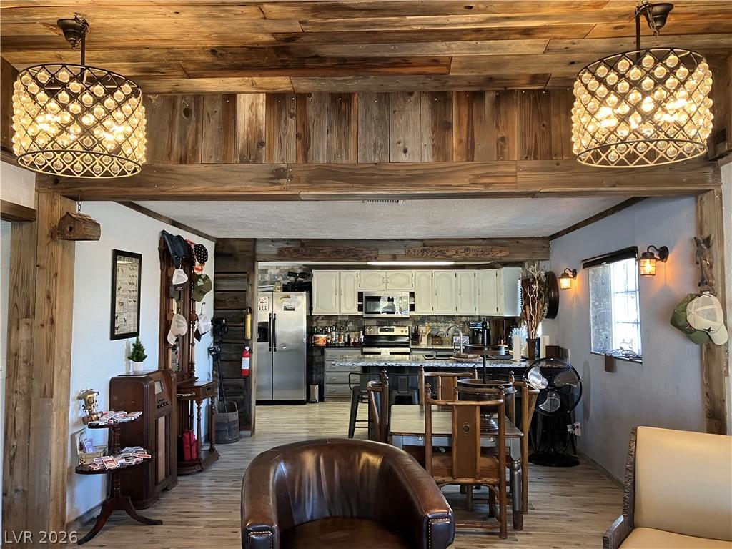 Image 4: Natural wood beams and paneling lend a rustic char