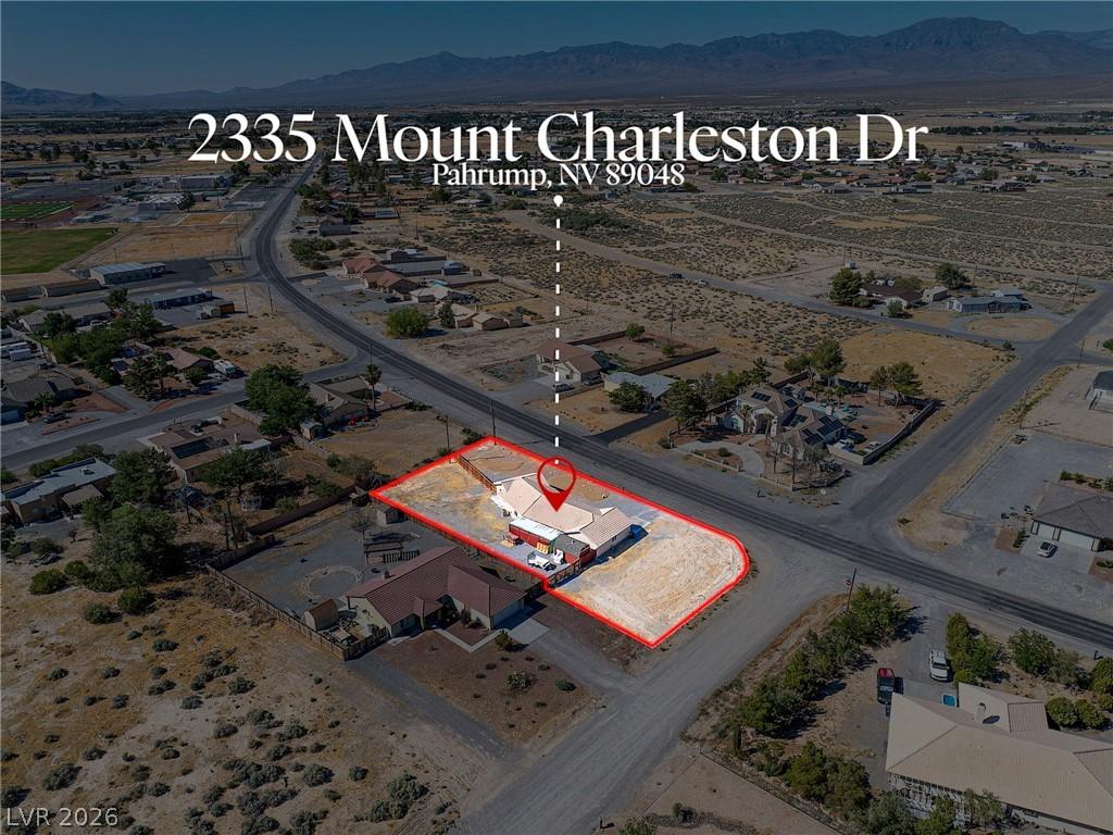 Image 2: Perched on an expansive corner lot, this desert pr