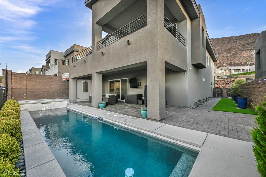 Image 2: An inviting private pool and spa complement the co