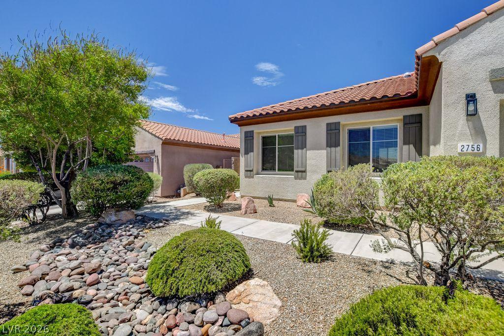 Image 4: Well-maintained desert landscaping creates an invi