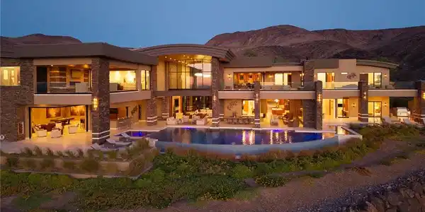 Image 3: Dramatic desert mountains frame this multi-level c