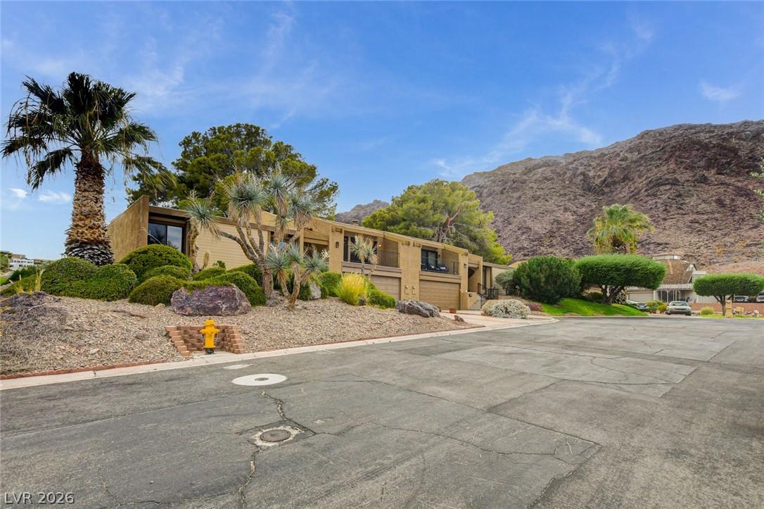 Image 4: An inviting exterior with nestled against a mounta