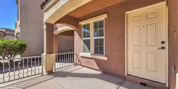 Image 4: An inviting covered entryway welcomes guests on a