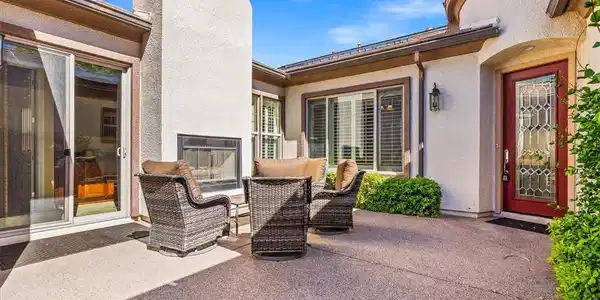 Image 4: An inviting courtyard features textured stucco wal