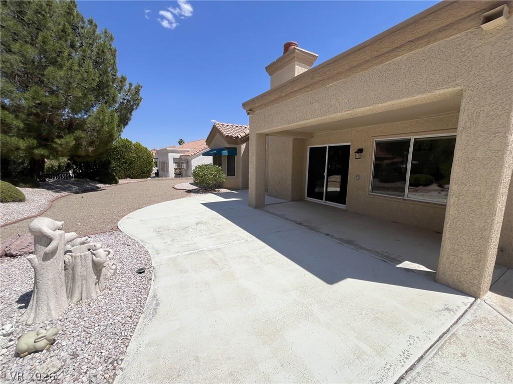 Image 3: Back Shady extended patio (on larger lot) with tre