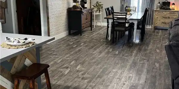 Image 4: Dining room with dark wood-style flooring and bric