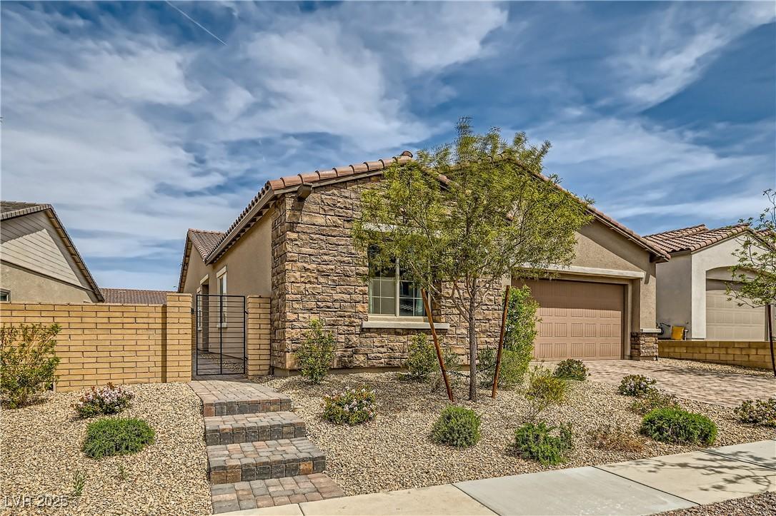 Image 3: View of front of house featuring stucco siding, st