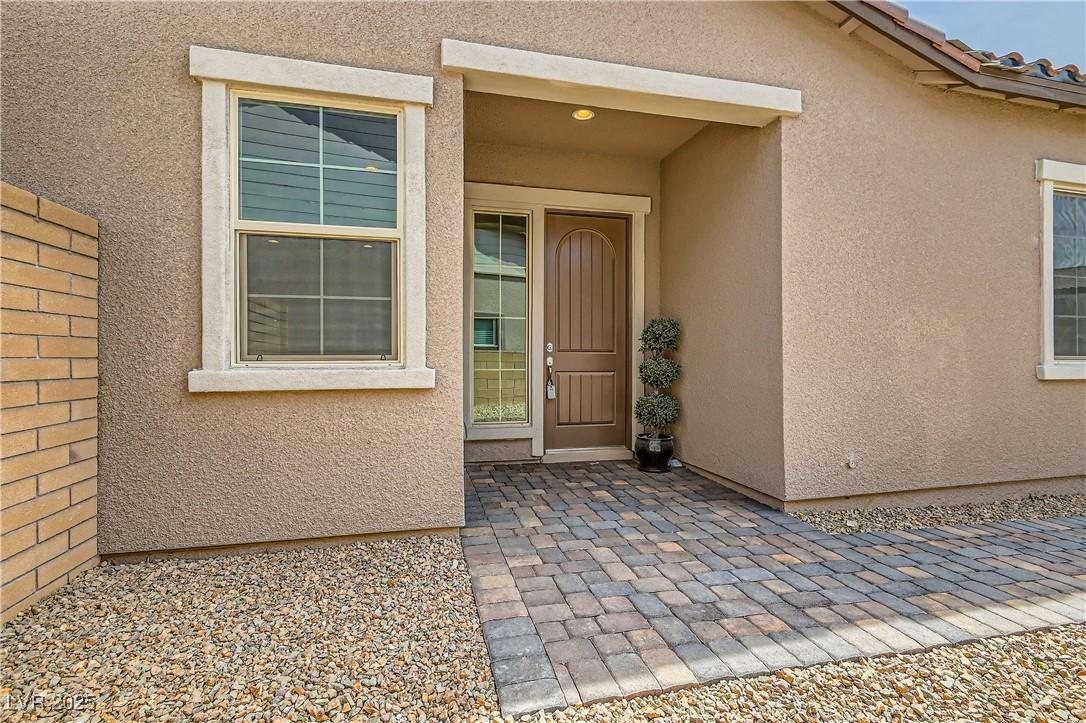 Image 4: Doorway to property featuring a patio area and stu