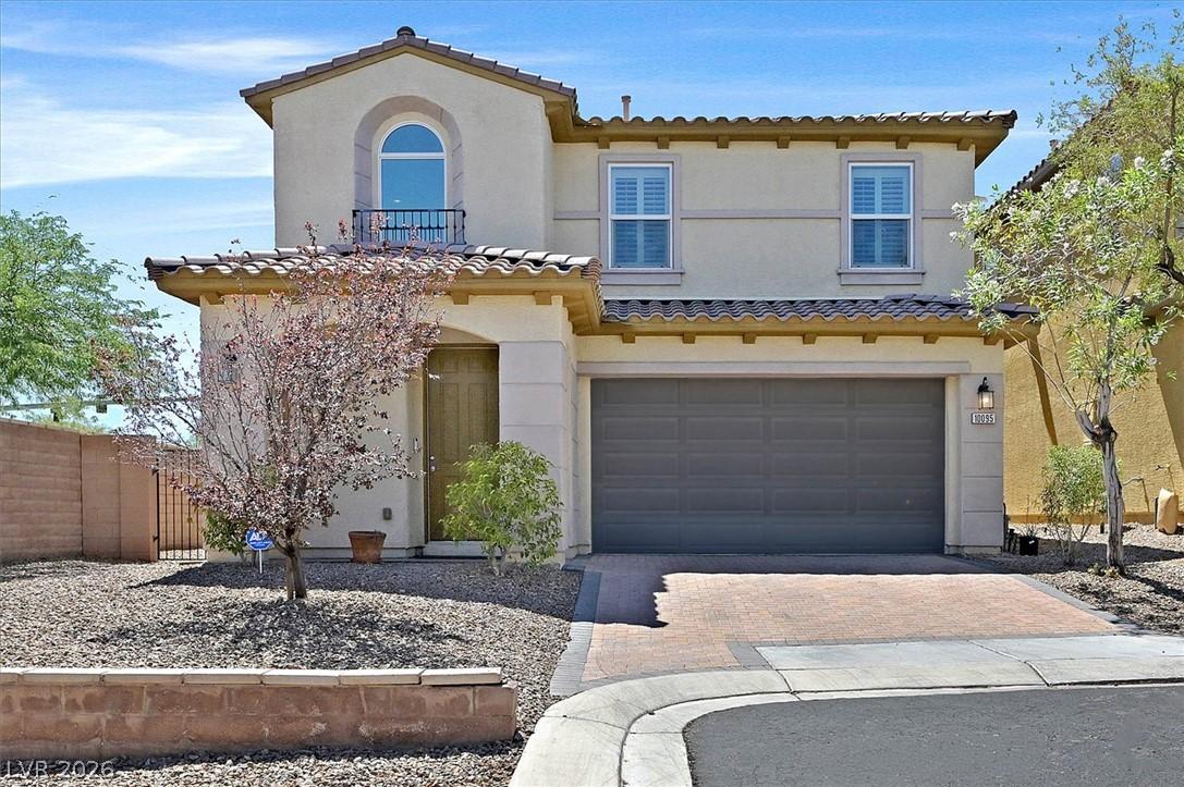 Image 2: A charming stucco home with a terracotta roof, fea