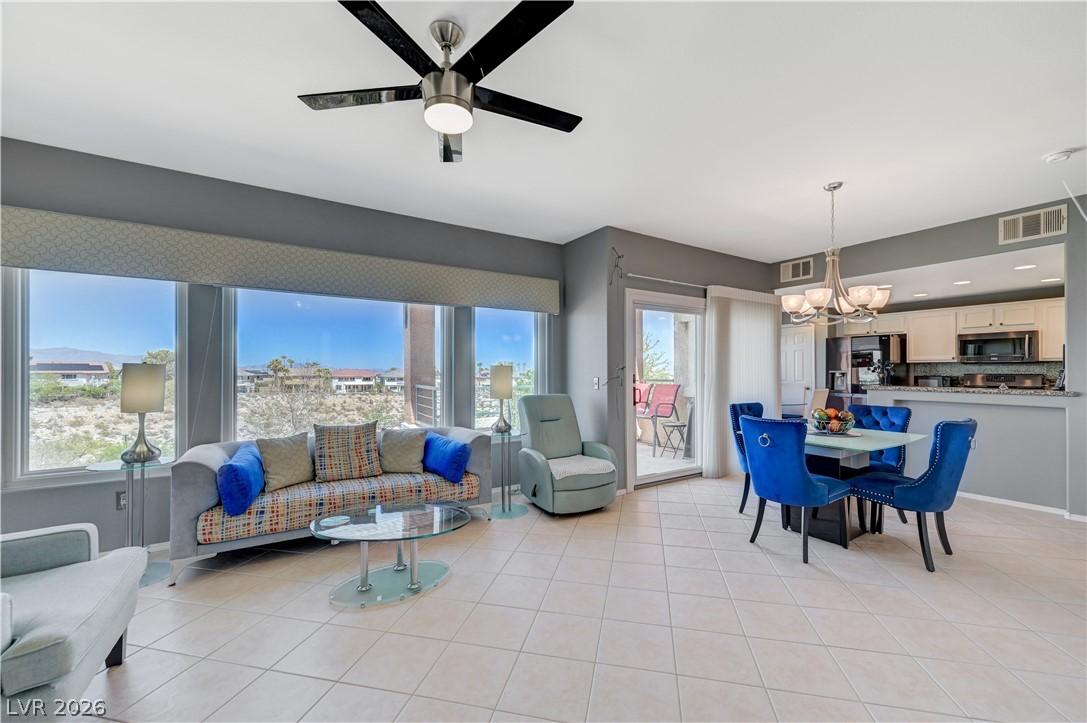 Image 2: Floor-to-ceiling windows frame a panoramic desert