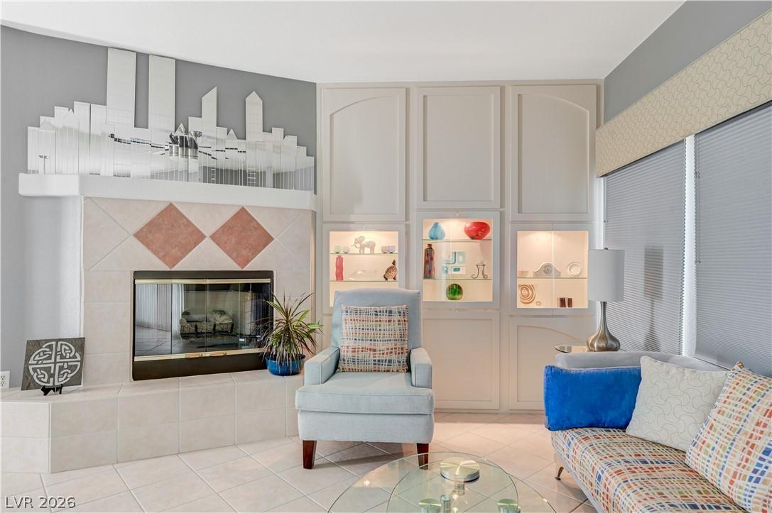 Image 3: A refined living area featuring a tiled fireplace