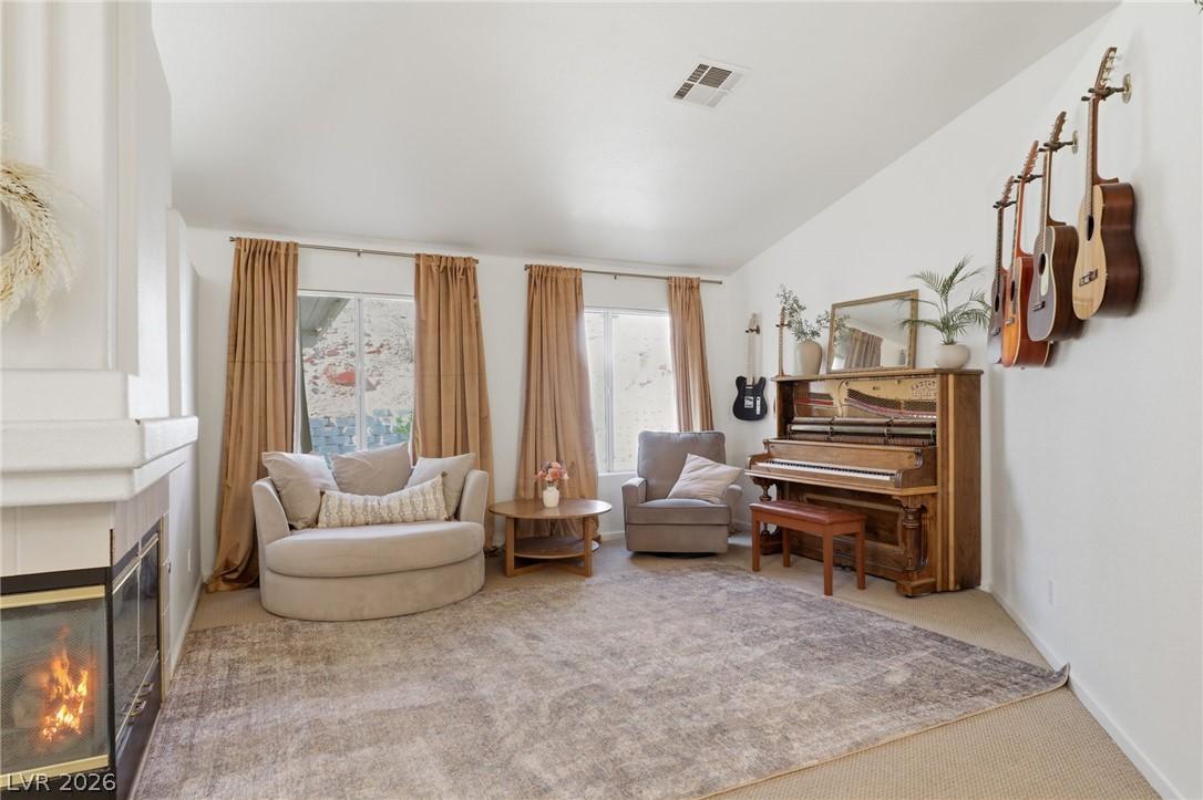 Image 4: cozy living room with 3 sided fireplace