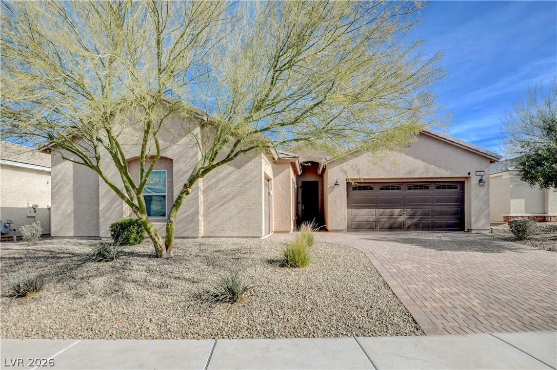 Image 1: A desert-friendly landscape surrounds this welcomi