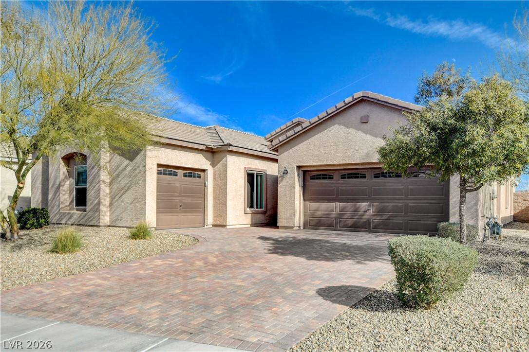 Image 4: A beautifully paved driveway leads to a welcoming