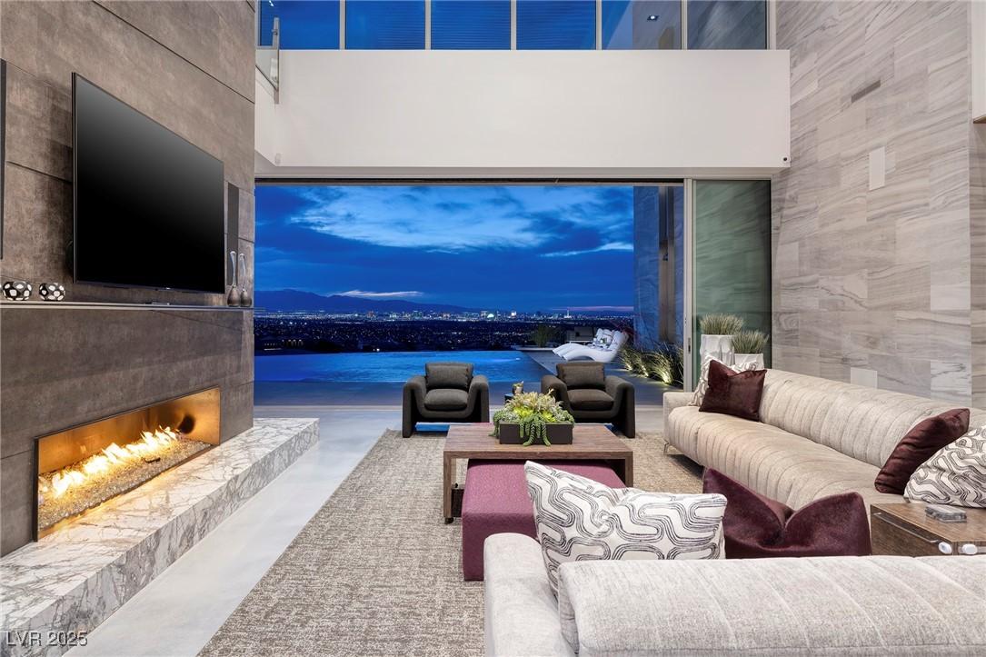 Image 2: Living area with finished concrete flooring, a hig