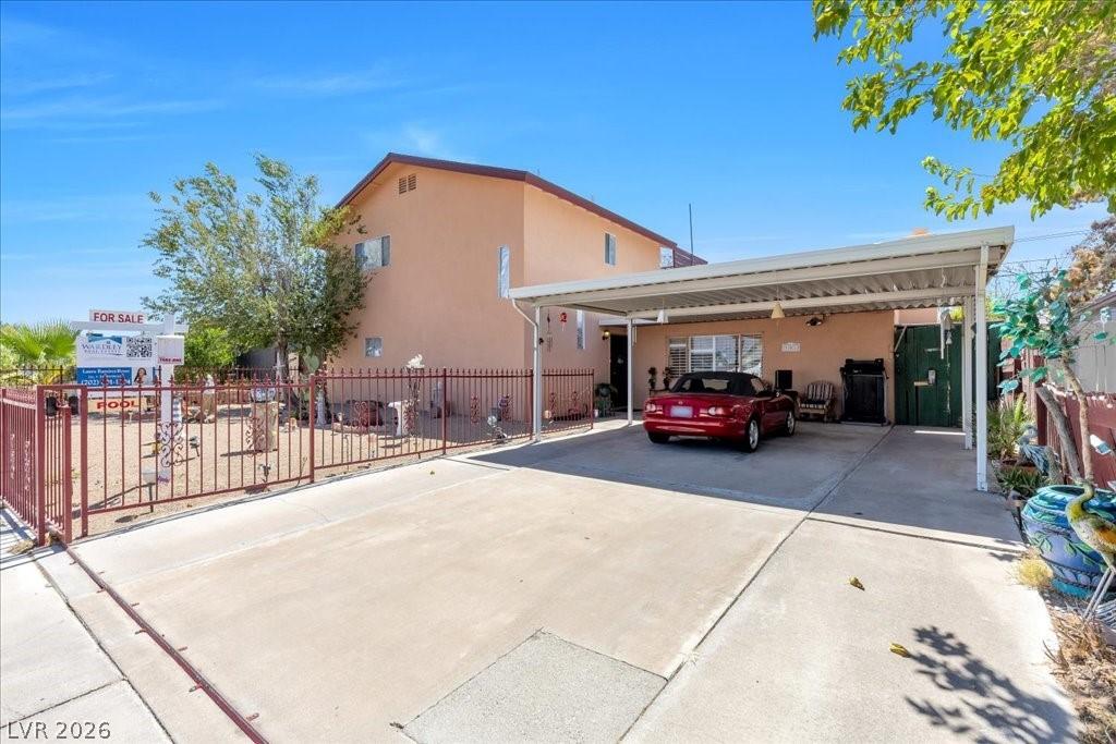 Image 2: Discover this property offering a practical carpor
