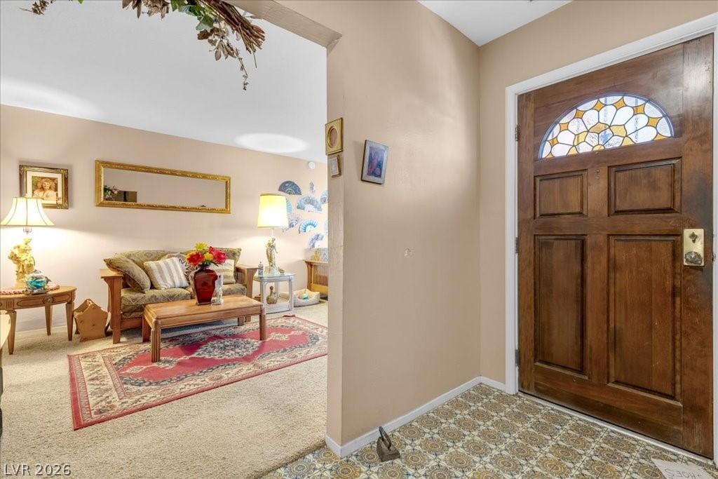 Image 3: Enter this inviting living space, featuring a clas