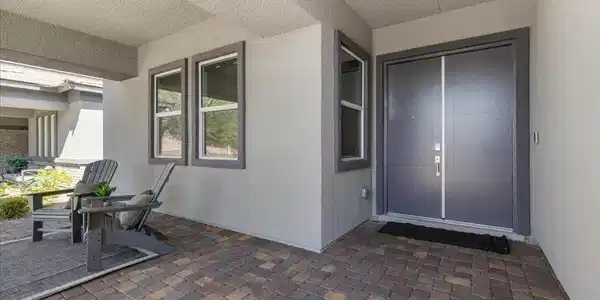 Image 3: A welcoming front entrance with double doors, a co